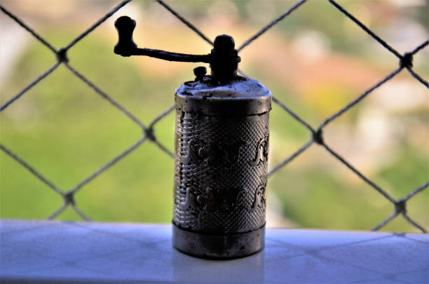 Old metal pepper grinder worked on the countertop