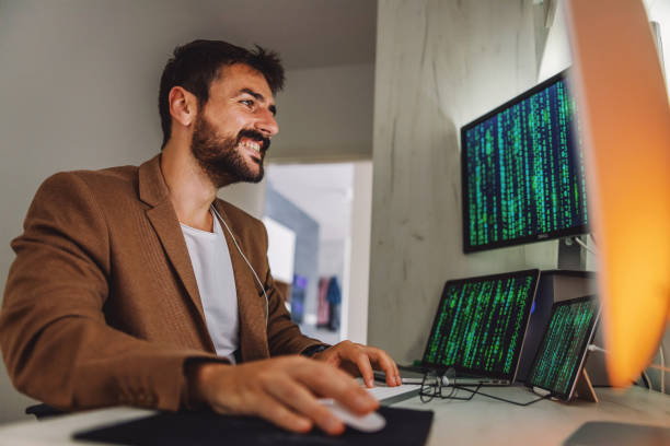 istock Young handsome programmer dressed business casual sitting in his office and working on important project . Quarantine during corona virus concept. 1266823432