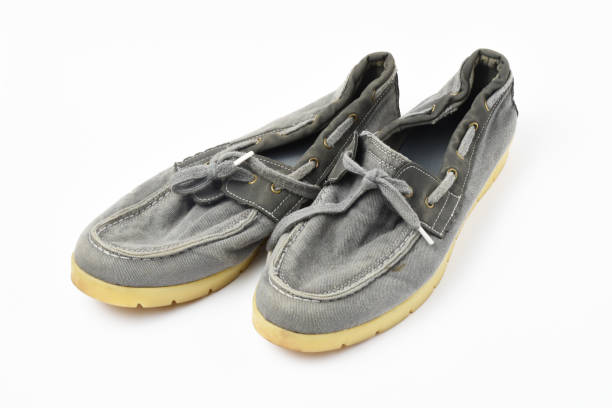 istock A pair of old shoes on white background 1266824639