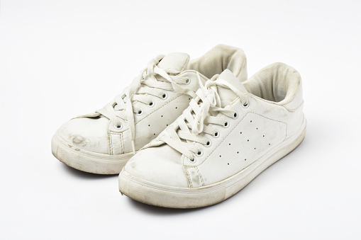 A pair of old shoes on white background