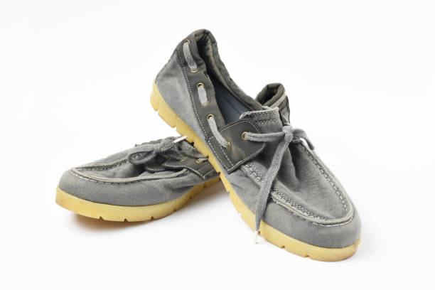 istock A pair of old shoes on white background 1266825978