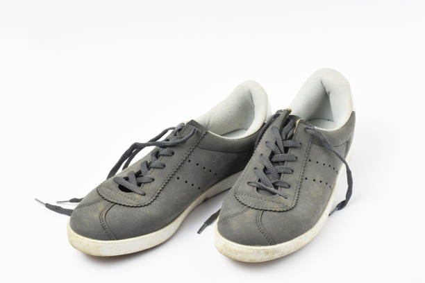 istock A pair of old shoes on white background 1266826057