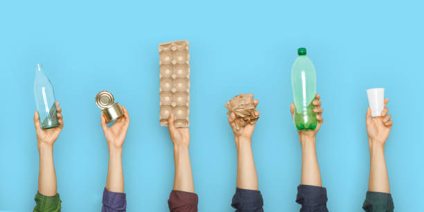 istock Concept of garbage sorting and ecology. Photo for website banner. Hands holding different trash 1266827515
