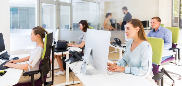 istock Business people working and communicating together 1266827587
