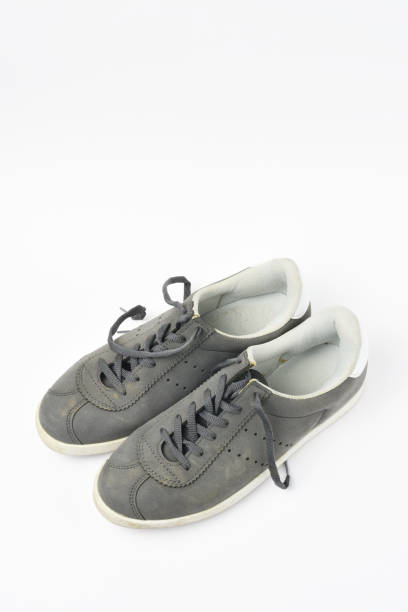 istock A pair of old shoes on white background 1266827623