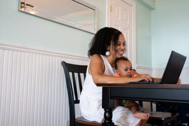 istock Black woman working from home with her baby son 1266827670