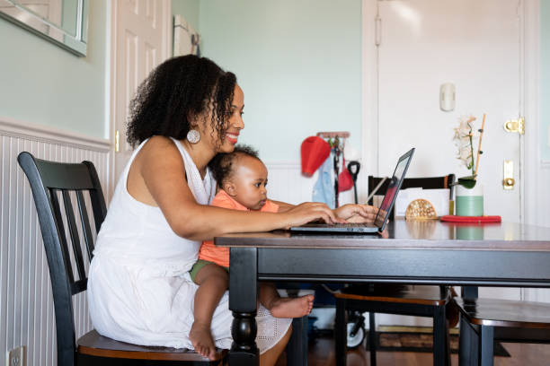 istock Black woman working from home with her baby son 1266827685