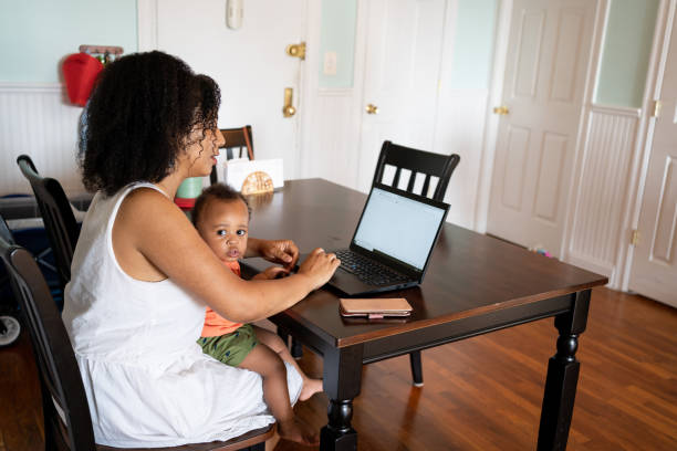 istock Black woman working from home with her baby son 1266827700