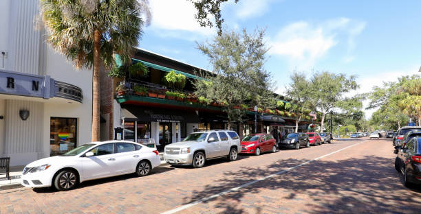 Luxury shopping at Winter Park Winter Park, Florida, USA - January 26, 2020:  Retail stores on South Park Avenue in downtown Winter Park.  Famous for it's upscale shopping and world class museums. winter park florida stock pictures, royalty-free photos & images
