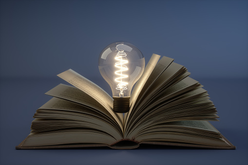 Incandescent Bulb With Books.