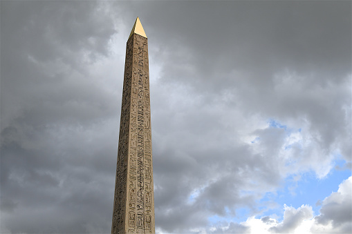 Paris, France-08 17 2020:The Obelisk of the Place de la Concorde in Paris, France.At the bottom of the Champs Elysées and set in the centre of one of the most well known traffic circles in the world stands an ancient Egyptian obelisk from the Luxor Temple.