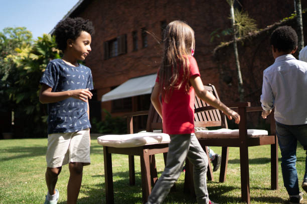 istock Kids playing dancing chairs in the backyard 1266835879
