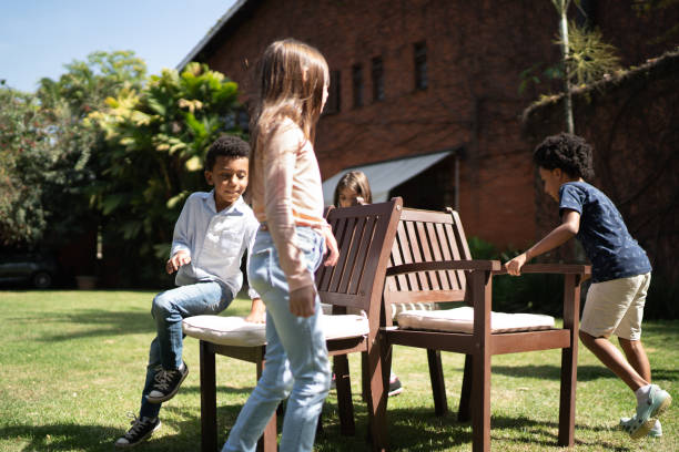 istock Kids playing dancing chairs in the backyard 1266835944