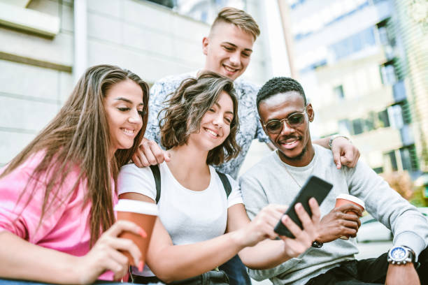 istock Multi Racial Friends Taking Selfie While Waiting For The Bus 1266835954