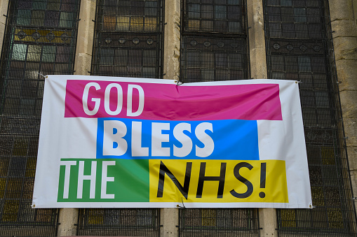 Pontypridd, Wales - May 2018: Home made banner supporting the NHS on the window of a church