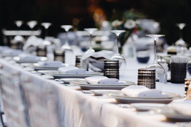 istock tableware Glasses, flower fork, knife served for dinner in restaurant with cozy interior 1266840352