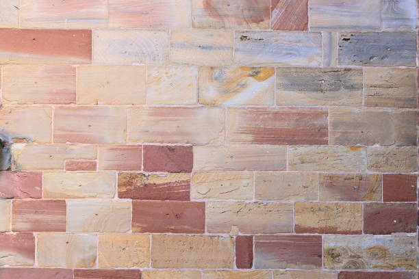 istock Old brick wall, old texture of red stone blocks closeup 1266844368