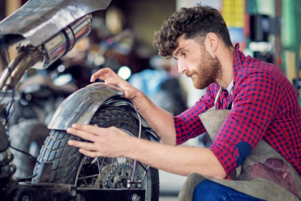 istock Man is working on a custom made motorbike 1266844403