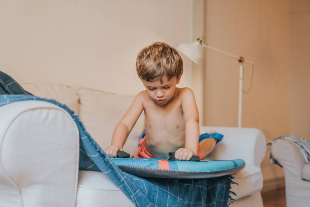istock Boys playing as they are at the beach during quarantine 1266845687