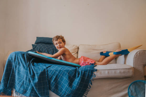 istock Boys playing as they are at the beach during quarantine 1266845872