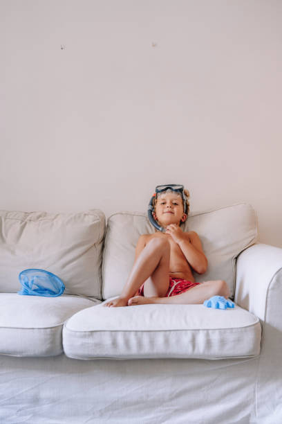 istock Boys playing as they are at the beach during quarantine 1266846525