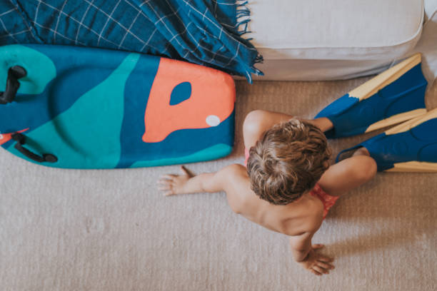 istock Boys playing as they are at the beach during quarantine 1266846537