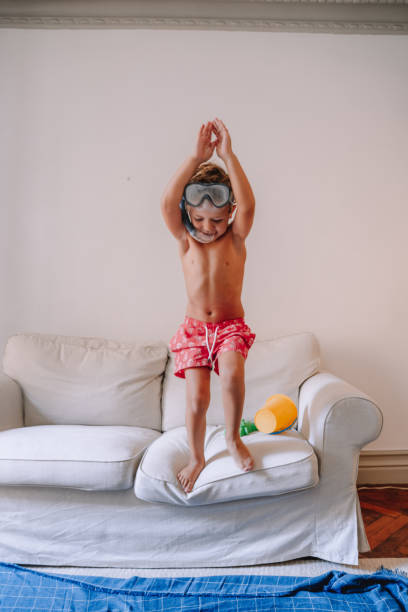 istock Boys playing as they are at the beach during quarantine 1266846569