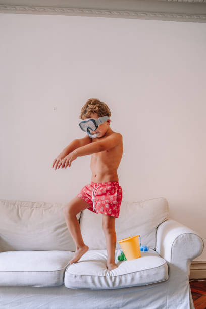 istock Boys playing as they are at the beach during quarantine 1266846587
