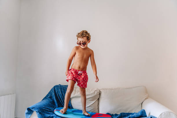 istock Boys playing as they are at the beach during quarantine 1266846658