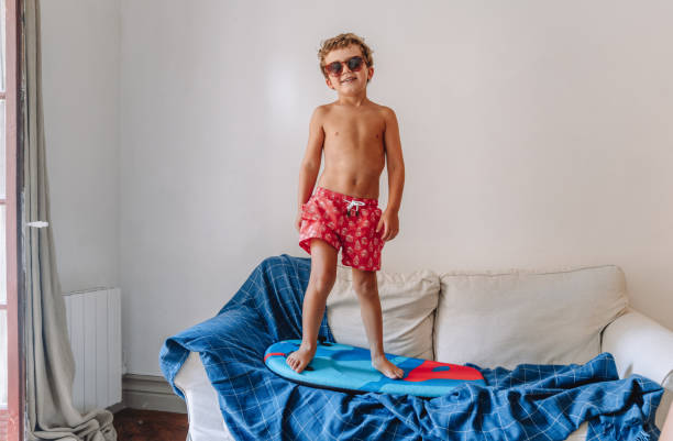 istock Boys playing as they are at the beach during quarantine 1266846685