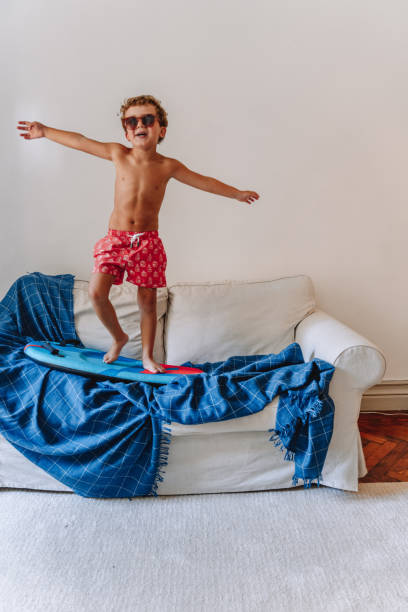 istock Boys playing as they are at the beach during quarantine 1266846780