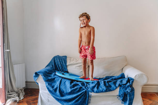 istock Boys playing as they are at the beach during quarantine 1266846788