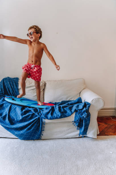 istock Boys playing as they are at the beach during quarantine 1266846805
