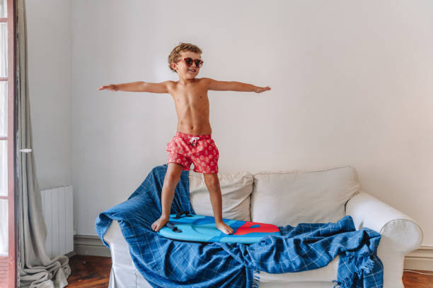 istock Boys playing as they are at the beach during quarantine 1266846835