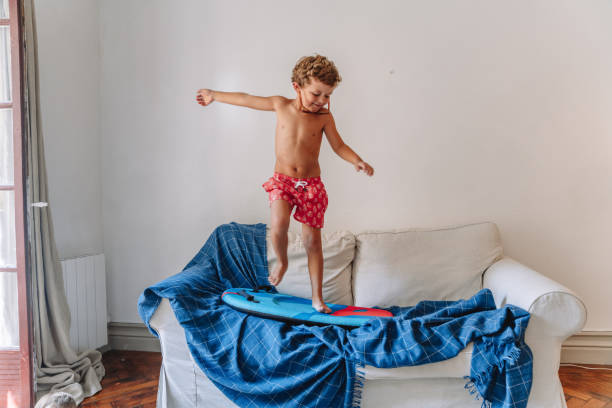 istock Boys playing as they are at the beach during quarantine 1266846846