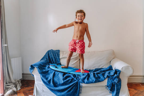 istock Boys playing as they are at the beach during quarantine 1266846867