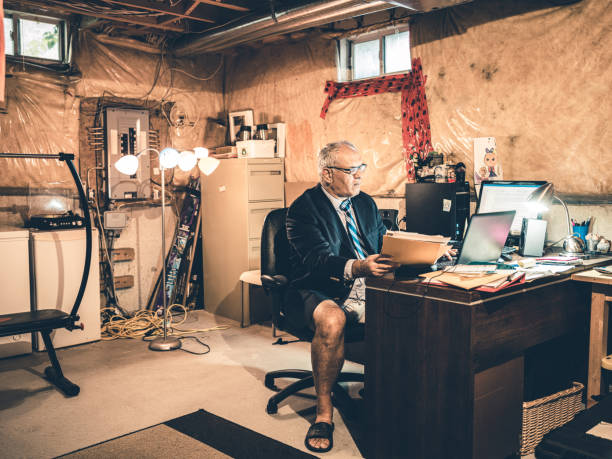 istock Mature man at work in his basement office 1266847017