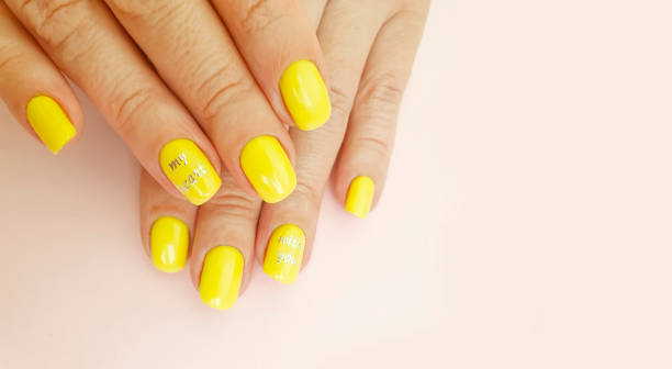 istock female hand beautiful manicure on a colored background 1266847811