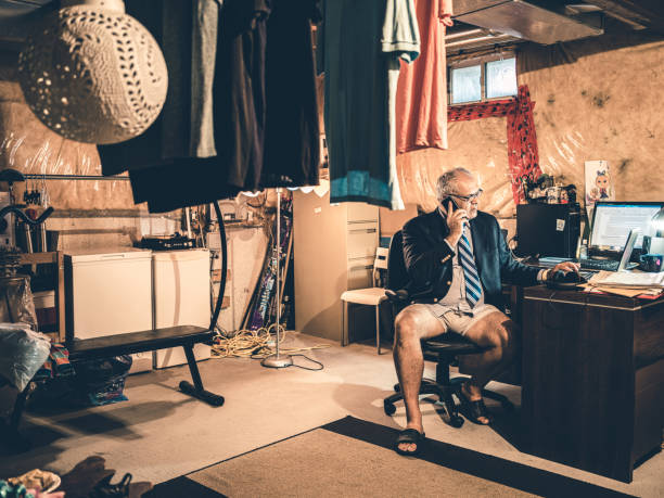 istock Mature man at work in his basement office 1266848051