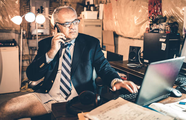 istock Mature man at work in his basement office 1266848124