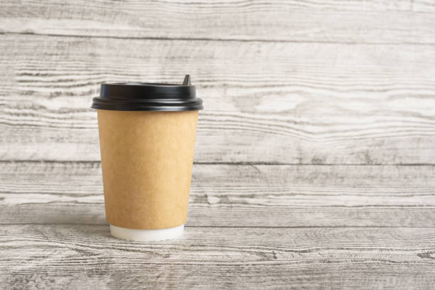 istock Zero waste coffee paper cup on the wooden background. 1266849795