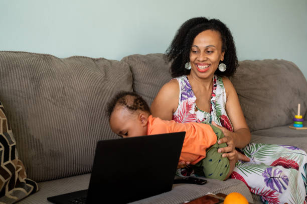 istock Black woman in a work break playing with her kid 1266851478