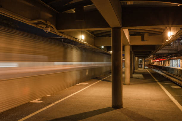istock Blurred motion of train leaving platform in city 1266852291