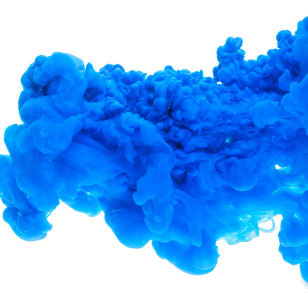 istock blue color paint ink pouring in water 1266856078