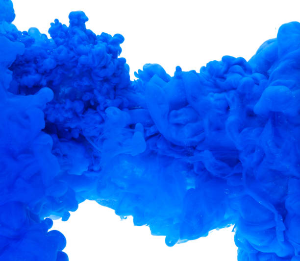 istock blue color paint ink pouring in water 1266856086