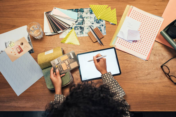 istock Designer Drawing on her Digital Tablet at the Office 1266858240