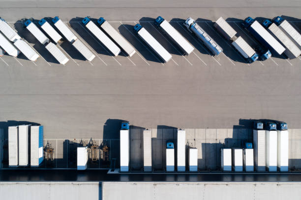 istock Aerial View of Trucks Loading at Logistic Center, Distribution Warehouse 1266858820