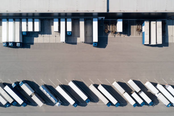 istock Aerial View of Trucks and Distribution Warehouse 1266858839