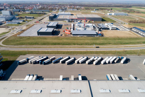 istock Aerial View of Trucks Loading at Logistic Center, Distribution Warehouse 1266858896