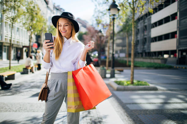 istock Calling a cab after a good day of shopping 1266859758